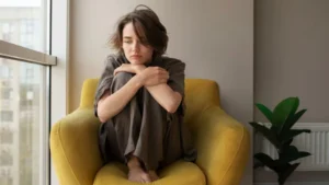A woman in stress sitting on a couch